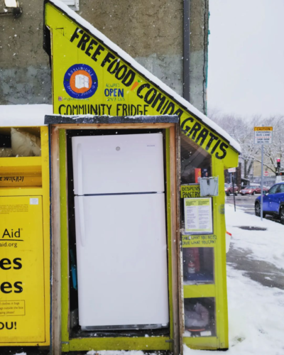 Roslindale community fridge with sign "free food comida gratis"